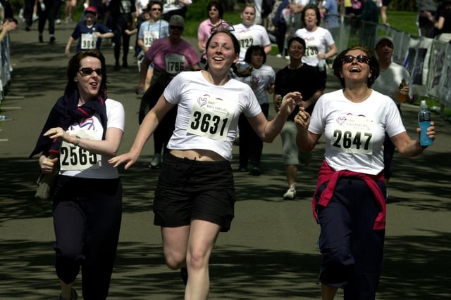 Runners crossing the finish line at the Race For Life at Roundhay Park. From the left: Mary McSharry, Helen Stephens and Jacqui Black from the Leeds Addiction Unit, on May 12, 2002.