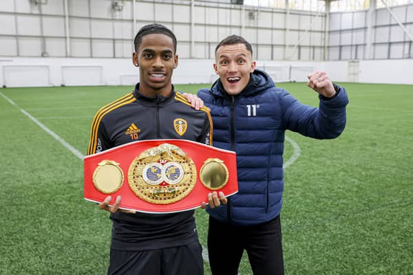 Leeds, UK:  IBF World Featherweight Title Holder Josh Warrington visits Leeds United Football club Crysencio Summerville who is holding the belt on his ring walk on fight night.
30 November 2022
Picture By Paul Currie Matchroom Boxing