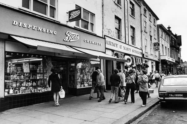 A street scene showing Boots, the Army and Navy stores and the Studley Royal pub/hotel in August 1973.
