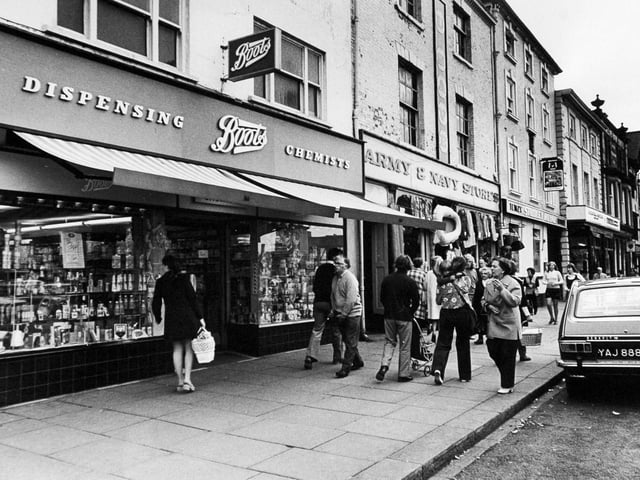 A street scene showing Boots, the Army and Navy stores and the Studley Royal pub/hotel in August 1973.