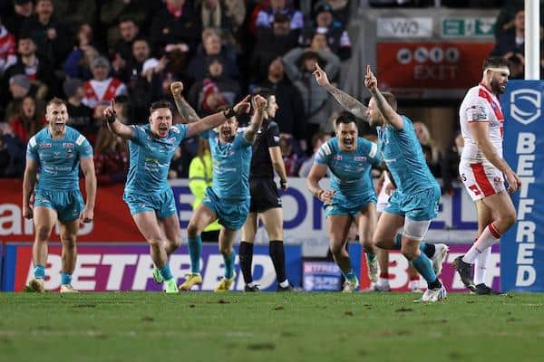Rhinos' Blake Austin, right, celebrates his last-minute winning drop goal at St Helens. Picture by Paul Currie/SWpix.com.