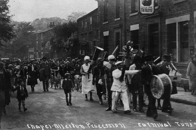 The Chapel Allerton Carnival procession passing the Regent Inn on Regent Street in June 1930. This section of the parade is led by a novelty band in fancy dress.