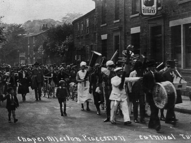 The Chapel Allerton Carnival procession passing the Regent Inn on Regent Street in June 1930. This section of the parade is led by a novelty band in fancy dress.