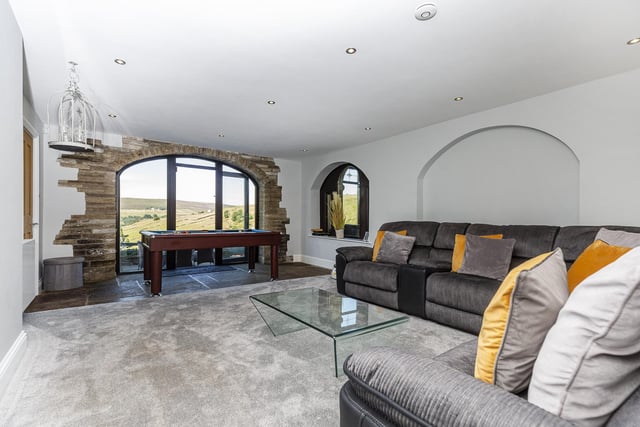 A games room adjoins this seating area within the property.