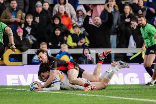 Jack Bird scores for Leeds Rhinos against Warrington Wolves. Picture by Alex Whitehead/SWpix.com.