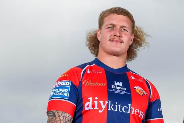 Caius Faatili models the retro Wildcats jersey Wakefield Trinity will wear in their Magic Weekend derby against Castleford Tigers. Picture by Allan McKenzie/SWpix.com.