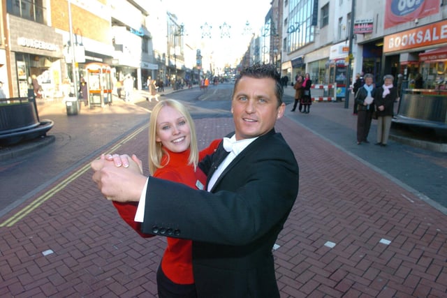 Cricketer and Strictly Come Dancing contestant Darren Gough visits Yorkshire Building Society in Leeds city centre to support simpler steps towards personal finance.
Pictured, Darren Gough dancing with Judith Johnson customer advisor at the branch, on December 7, 2005.