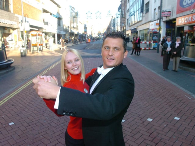 Cricketer and Strictly Come Dancing contestant Darren Gough visits Yorkshire Building Society in Leeds city centre to support simpler steps towards personal finance.
Pictured, Darren Gough dancing with Judith Johnson customer advisor at the branch, on December 7, 2005.