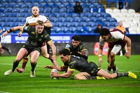 Brodie Croft scores one of his four tries in Leeds Rhinos' 56-22 win at Huddersfield Giants. Picture by Olly Hassell/SWpix.com.