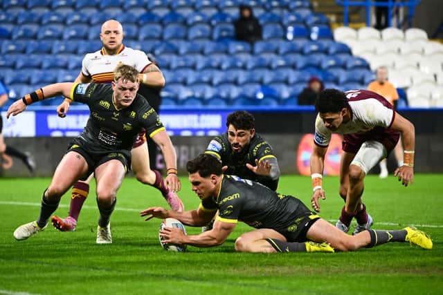 Brodie Croft scores one of his four tries in Leeds Rhinos' 56-22 win at Huddersfield Giants. Picture by Olly Hassell/SWpix.com.
