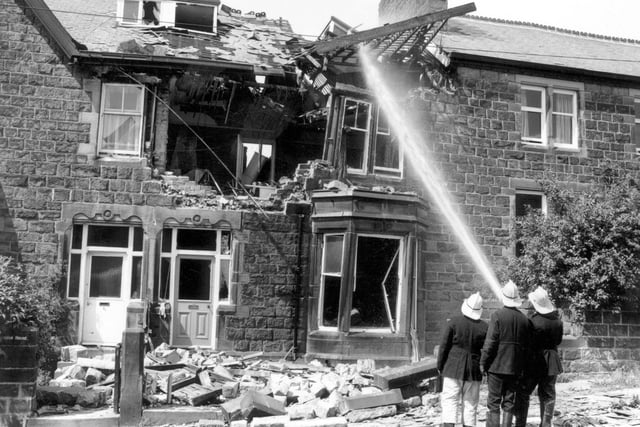 Firefighters ensure a blaze is out after a gas explosion at a house on Spring Wood Road in Rawdon in July 1970. The house was empty at the time.