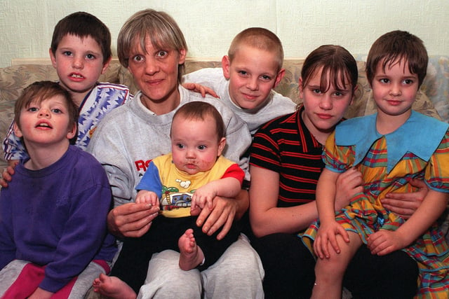 Home is where the heart is. Shirley Farrell with six of her seven children at her home  in Drighlington -  Vicky, 8,  Billy, 7, Timmy, 11, Samantha, 13, Nicola, 5, and baby Thomas,  six months in January 1997.
