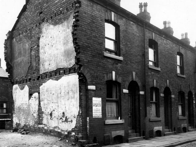Barmouth Street in September 1947.  Numbers 2 and 4 have been demolished, (the door and number of number 4 partly remains). An old poster is stuck to the wall.