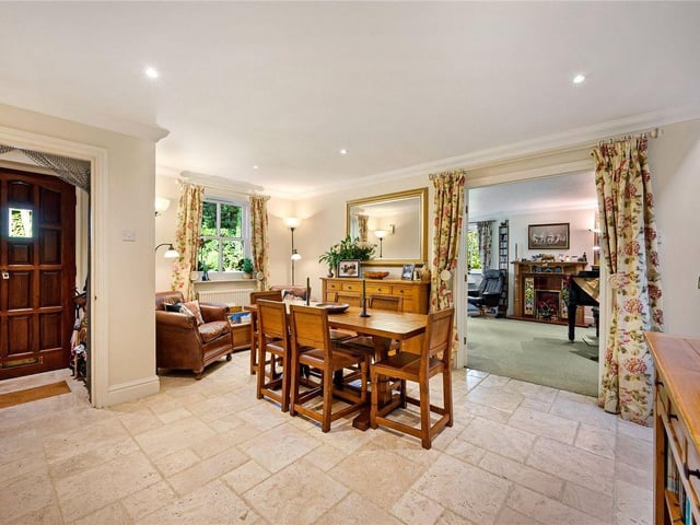 A ground floor entrance vestibule opens onto a reception dining hall, which has a staircase to the first floor and a guest W.C.