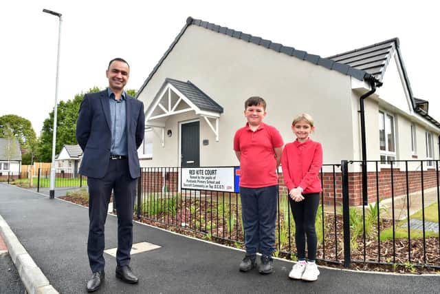 Coun Mohammed Rafique at a new Leeds City Council housing development in Seacroft, with Parklands Primary School pupils Harrison Hirst and Rihanna Kaye. Picture: Leeds City Council.