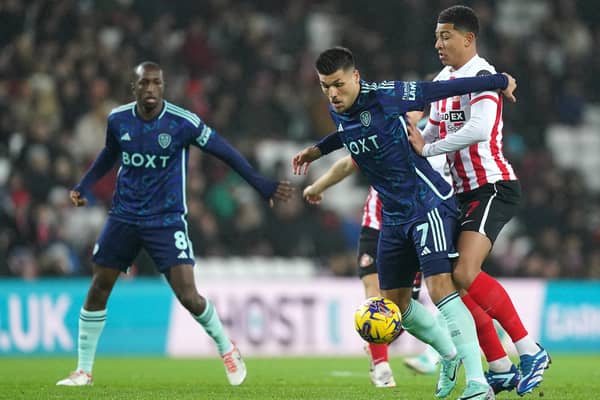 'STILL WAITING': For Joel Piroe, centre, to 'consistently take flight' from the four regular starters in Leeds United's attacking quartet, the Dutchman pictured battling it out with  
 Sunderland's Jobe Bellingham in Tuesday night's 1-0 Championship defeat at the Stadium of Light. Photo by Mike Egerton/PA Wire.