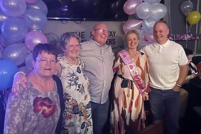 Susan Gervaise, wearing the sash, is pictured with her long-lost siblings, Angela, Catherine, Roger and David.