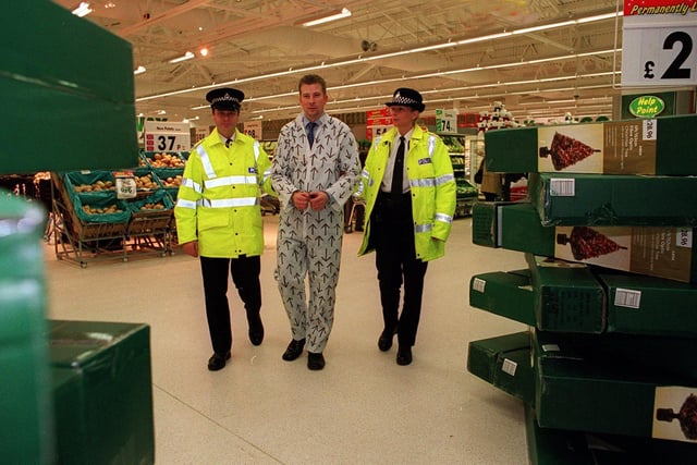 Asda Pudsey's general store manager Peter Brigden, in a 'mock arrest' by PC Marie Exley and Inspector Andy Oddy, as part of a stunt to raise money for Children in Need. He was taken to Pudsey Police Station on November 15, 2001 - and only to be released 'when enough money had been raised' as part of the comedy appeal.