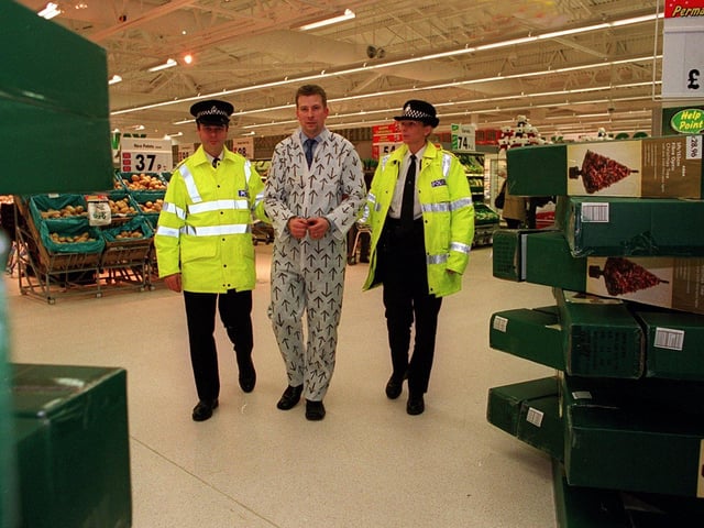 Asda Pudsey's general store manager Peter Brigden, in a 'mock arrest' by PC Marie Exley and Inspector Andy Oddy, as part of a stunt to raise money for Children in Need. He was taken to Pudsey Police Station on November 15, 2001 - and only to be released 'when enough money had been raised' as part of the comedy appeal.
