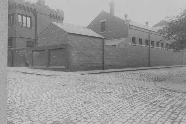 The junction of Fenton Street and Carnaby Street looking east, showing headquarters of Territorial Force, 1st West Riding Brigade Royal Field Artillery at 27, Fenton Street. Paving Stones and stone sets in foreground. Pictured in August 1913.