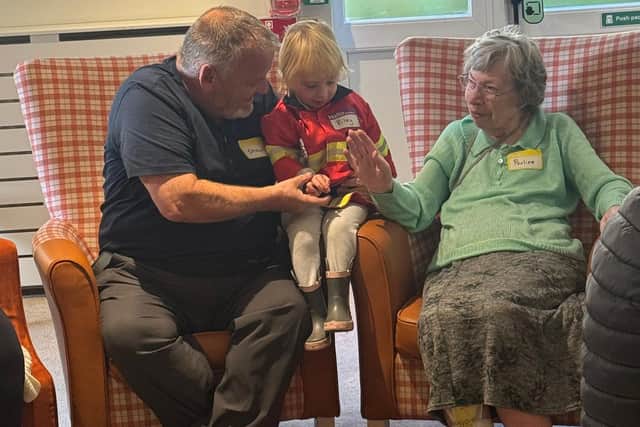 Residents at HC-One’s Colton Lodges Care Home with children from Songs & Smiles baby group