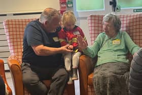 Residents at HC-One’s Colton Lodges Care Home with children from Songs & Smiles baby group