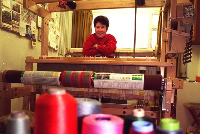 This is Janet Hutchinson with a weaving loom in her converted garage at home in Thorner.