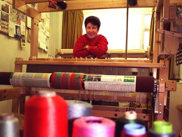 This is Janet Hutchinson with a weaving loom in her converted garage at home in Thorner.