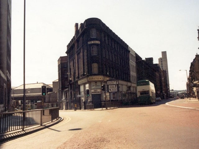 A view from City Square, showing the junctions with Aire Street, left, and Wellington Street, right, in May 1980. In the centre the triangular building houses numbers 56 to 62 Aire Street and numbers 11 and 11A Wellington Street. Barstows Gents Hairdressing, founded in the early 1900s, is visible on the corner and had occupied this building since 1910. Barstow's was a family run business and, when it opened, offered 4d shaves and 10d haircuts (one shilling on a Saturday!) The shop also sold confectionery and operated as a newsagents. Eventually, chiropody was added to the services. Just before the shop closed for re-development of the site in the June of 1980 haircuts had risen to £1.30! On demolition of these buildings work began on the red brick six storey City Square House, which was completed in 1983.
