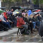 Such was the extent of the desire to pay public respect to her, people descended upon the city centre armed with umbrellas, ponchos and waterproof coats to ensure they could watch the live screening. Image: Simon Hulme