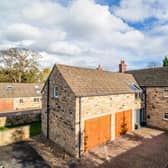 The stone built property with double garage is for sale priced £795,000.