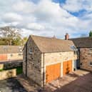 The stone built property with double garage is for sale priced £795,000.