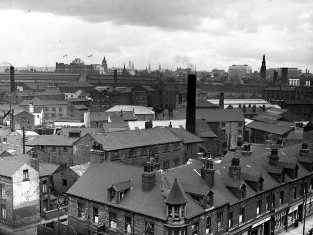 An elevated view from Hunslet's Christ Church on Meadow Lane, looking north-west over the city. Several factory chimneys are visible among the roofs. Pictured in June 1955.