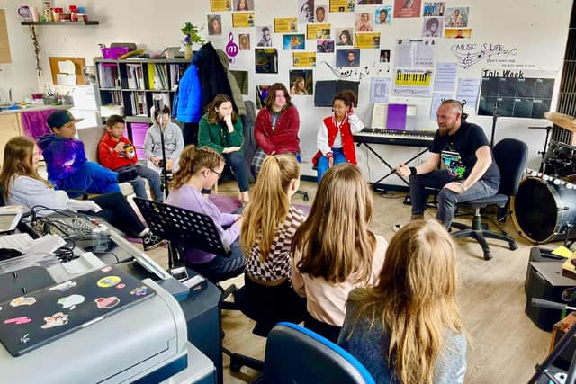 Alongside full-time job, being a rapper and an advocate for mental health, Paul Wilkes hosts rap workshops with children in schools and community groups to give them a chance to be able to express themselves through creative writing and performance. Pictured is Rap for Good workshop at at Musicular Instrumental in Bradford. Photo: Mon Slattery