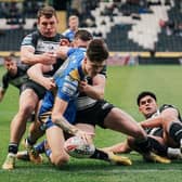 Teenager winger Riley Lumnb scores a spectacular try on his Leeds Rhinos debut away to Hull FC. Picture by Alex Whitehead/SWpix.com.