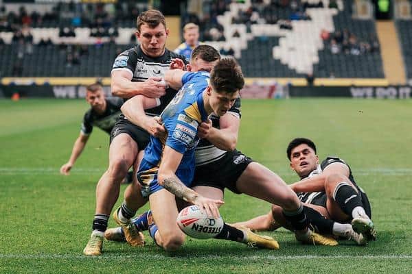 Teenager winger Riley Lumnb scores a spectacular try on his Leeds Rhinos debut away to Hull FC. Picture by Alex Whitehead/SWpix.com.