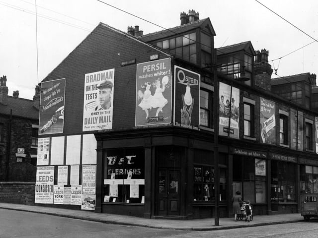 Meanwood Road showing shops at junction with Oatland Road in August 1953. The shops shown are B & C cleaners, Home Repair Service and C Harding drapers.