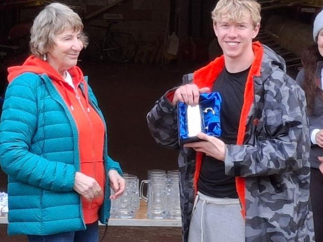 Mike's mother presenting his award to Liam Carroll (Burton Leander)