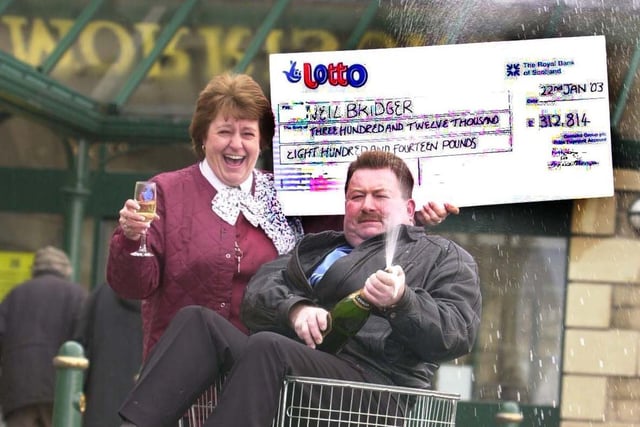 This is Neil Bridger who has bought a winner lottery ticket from Morrison's in Yeadon scooping £312,814 in January 2003. He is pictured with checkout operator Christine Potter who sold him the ticket.