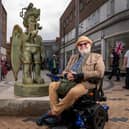 The 1.9m (6ft 2in) bronze sculpture and local artist Jason Wilsher-Mills who created it (Photo by Wakefield Council)