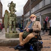 The 1.9m (6ft 2in) bronze sculpture and local artist Jason Wilsher-Mills who created it (Photo by Wakefield Council)