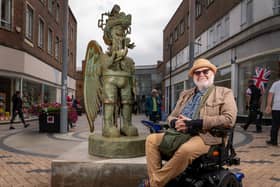 The 1.9m (6ft 2in) bronze sculpture and local artist Jason Wilsher-Mills who created it (Photo by Wakefield Council)