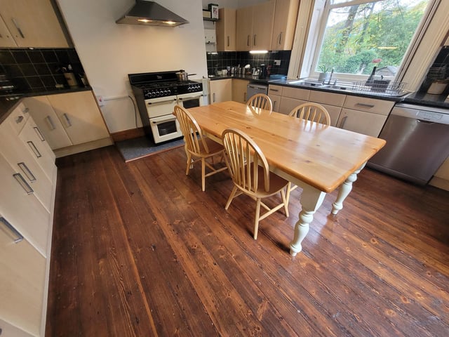 The kitchen with fitted units looks out over the garden.