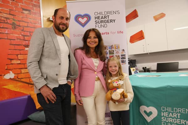 The personal monitoring devices from the Children's Heart Surgery Fund will give families the peace of mind away from the unit. From left, charity trustee Colin Clewes, Lea Ziff, and young patient Bella Rodgers.