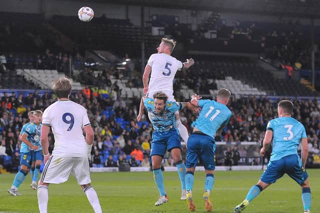 TOWERING PRESENCE: Whites captain Liam Cooper rises above the Southampton under-21s defence to net in Friday night's 6-2 victory at Elland Road.