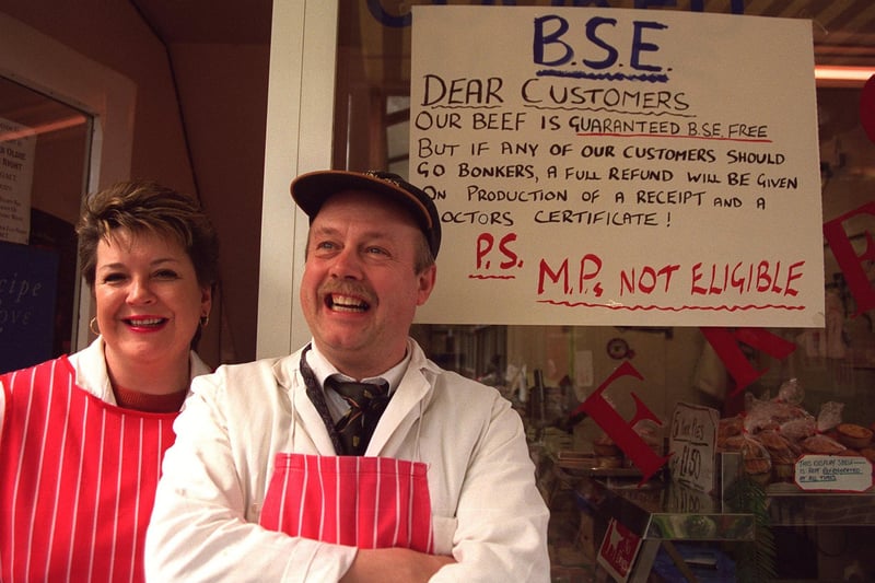 Rothwell butcher Paul Oxley and his wife Helen with a no-nonsense message outside their shop in April 1996.