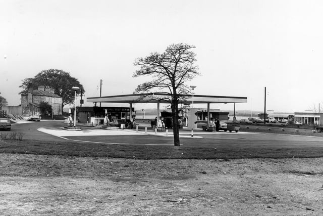 A petrol filling station on Great North Road at Aberford, known as Nuthill Self Serve. A Little Chef restaurant is seen in the background on the right. Pictured in May 1980.