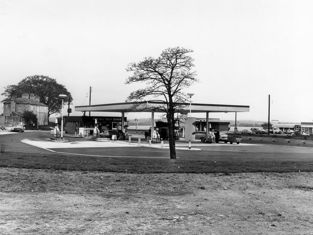 A petrol filling station on Great North Road at Aberford, known as Nuthill Self Serve. A Little Chef restaurant is seen in the background on the right. Pictured in May 1980.