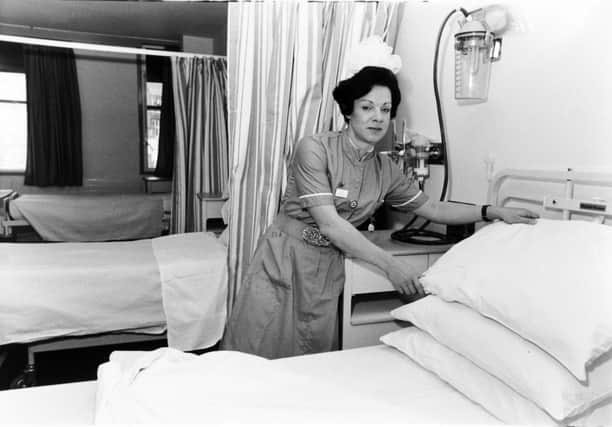 Ward sister Anne-Marie Butterfield prepares a bed for her first patient at the newly opened Clarendon Wing at Leeds General Infirmary.