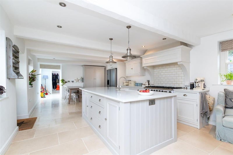 The kitchen has double glazed sash windows to the front and rear, with a limestone tiled floor making it light and airy.